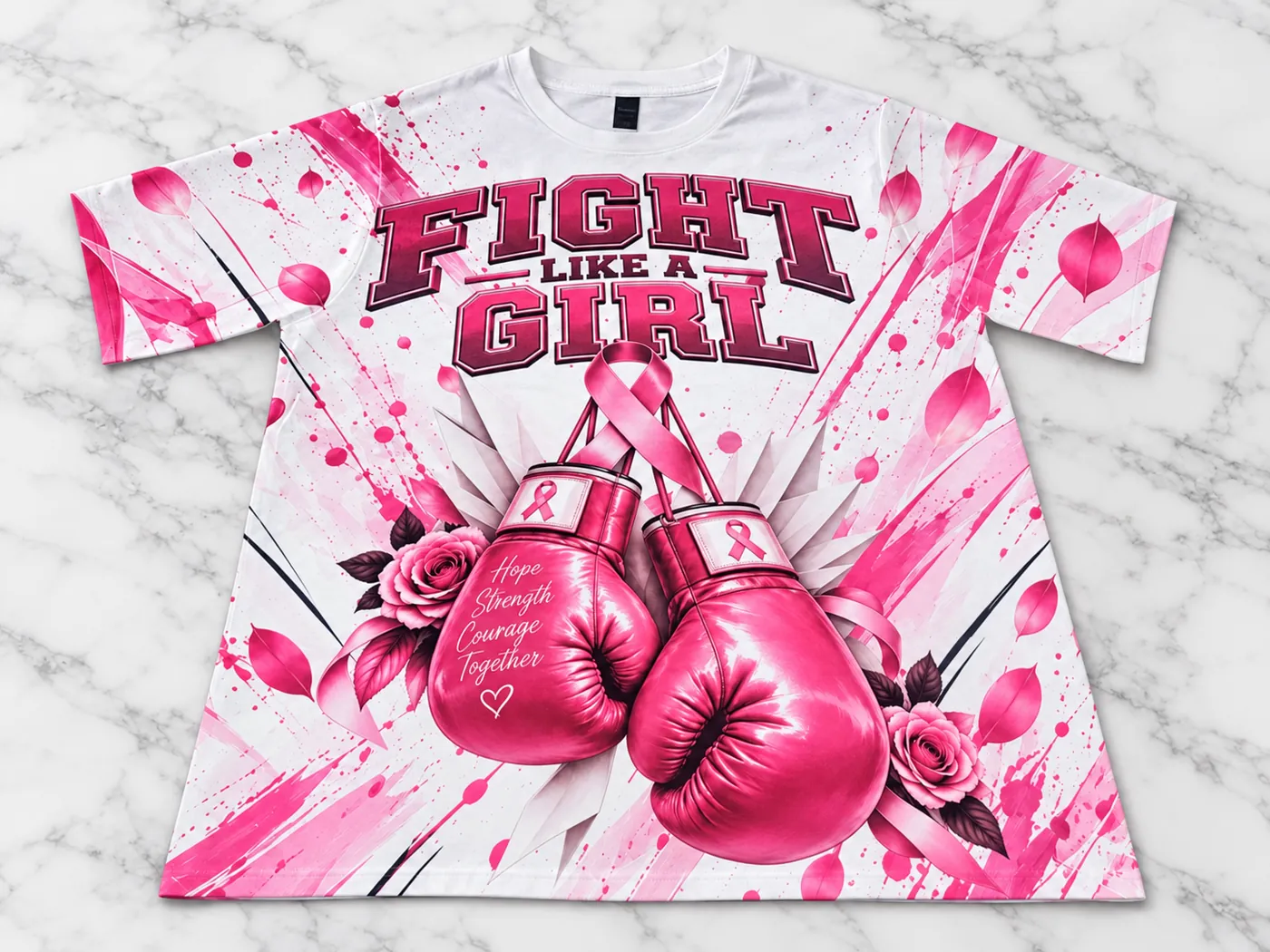 Fight Like a Girl Breast Cancer Awareness tee in pink and white with boxing gloves and roses, on marble
